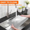 Stainless steel cutting board with lip, being rinsed under running water in a kitchen sink, Honesty House brand, silver color.