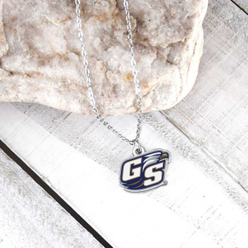 Georgia Southern Eagles Charm Necklace, silver chain with GS logo pendant, blue and white details, displayed on wooden background with stone.