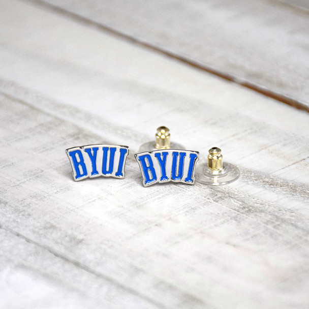 BYU Idaho post earrings in blue and gold, BYUI logo, stud style earrings with clear backs and gold posts, displayed on white wood.