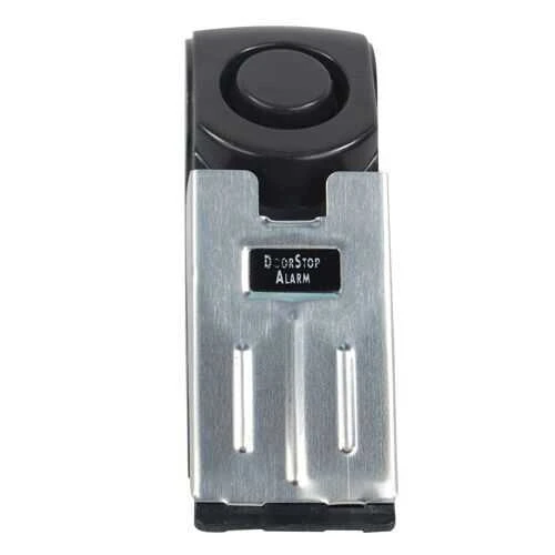 Super Door Stop Alarm, silver and black device with button and label, security alarm product for door safety and protection.