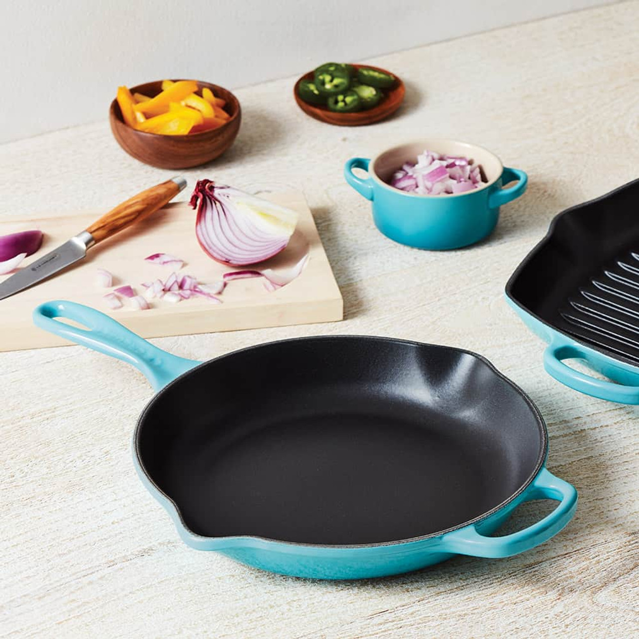 https://cdn11.bigcommerce.com/s-hccytny0od/images/stencil/1280x1280/products/1895/6453/le-creuset-signature-skillet-caribbean__29330.1626897049.jpg?c=2?imbypass=on