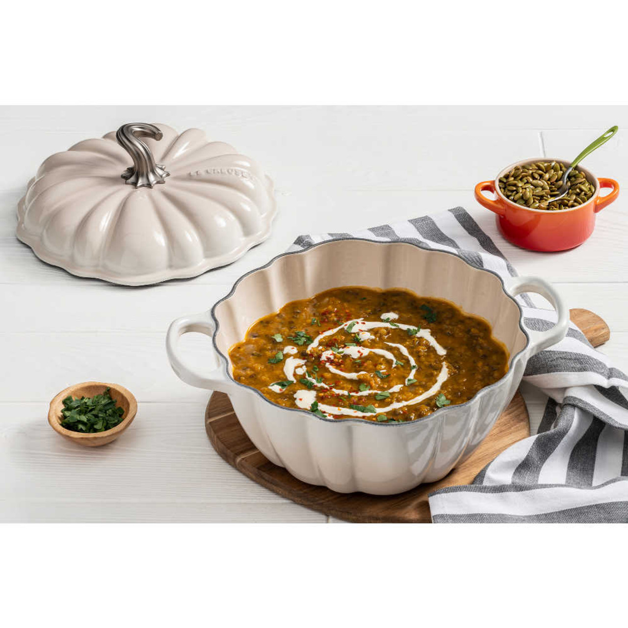 https://cdn11.bigcommerce.com/s-hccytny0od/images/stencil/1280x1280/products/4984/21122/Le_Creuset_Pumpkin_Cocotte_in_Meringue_1__88963.1660756516.jpg?c=2?imbypass=on