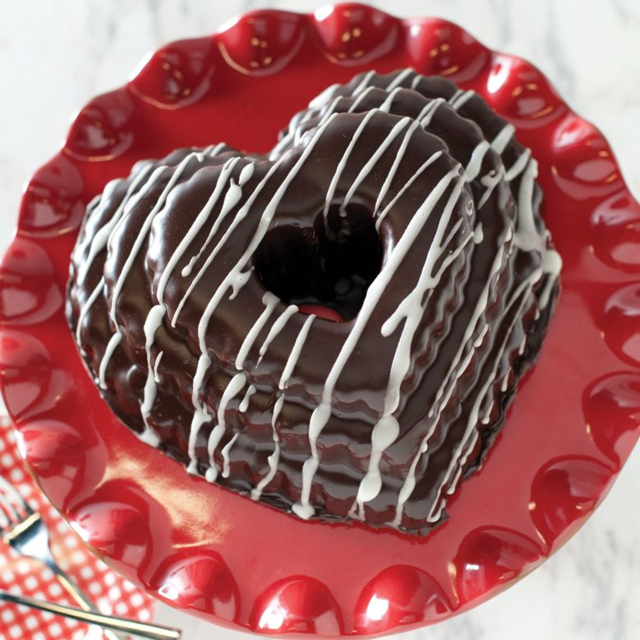 https://cdn11.bigcommerce.com/s-hccytny0od/images/stencil/1280x1280/products/741/3933/nordic-ware-tiered-heart-bundt-pan-4__69238.1583507143.jpg?c=2?imbypass=on