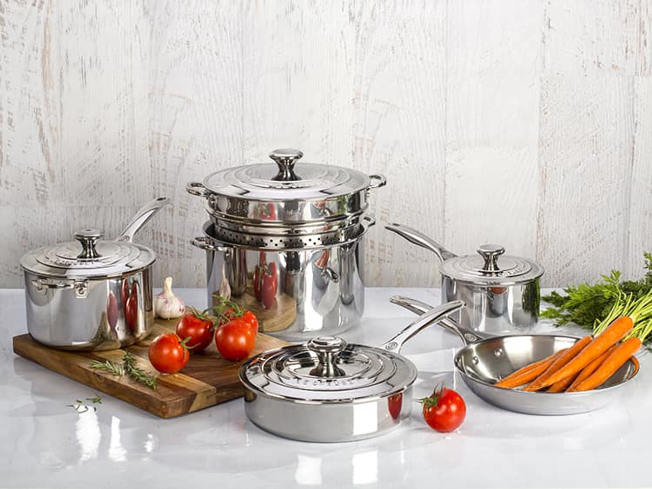 Le Creuset ~ Stainless Steel ~ 7 Piece Set (10 Fry Pan, 2 qt. Saucepan w/ Lid, 3 qt. Saute Pan w/Lid, 7 qt. Stockpot w/Lid), Price $580.00 in  Madison, MS from Persnickety