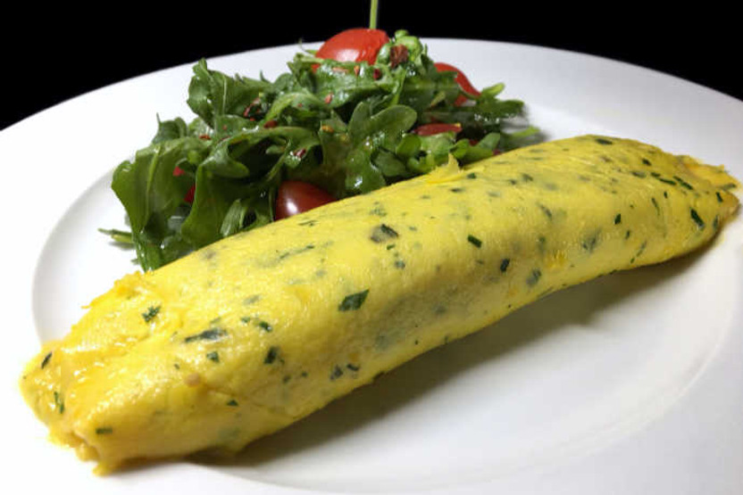Delicious Classic French Omelet Still On A Cast Iron Pan On Top Of