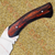 Featuring a finely crafted wooden handle, this full tang replica knife provides a comfortable grip while capturing the distinctive tribal-inspired Na'vi design.
