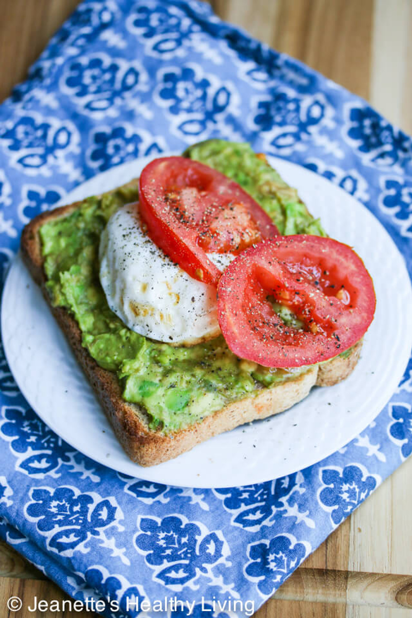 Breakfast Smashed Avocado Tomato Toast with Fried Poached Egg