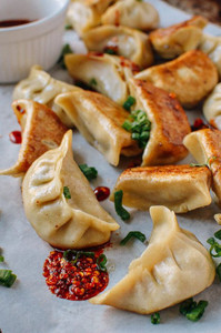 Chicken and Cilantro Dumpling Potstickers - 100 pieces per tray Chicken and Cilantro Dumpling Potstickers - 100 pieces per tray