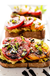 Avocado and Heirloom Tomato Toast with Balsamic Drizzle Avocado and Heirloom Tomato Toast with Balsamic Drizzle