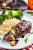 Bacon Wrapped Roasted Red Pepper and Goat Cheese Stuffed Chicken with Balsamic Drizzle and Basil Bacon Wrapped Roasted Red Pepper and Goat Cheese Stuffed Chicken with Balsamic Drizzle and Basil