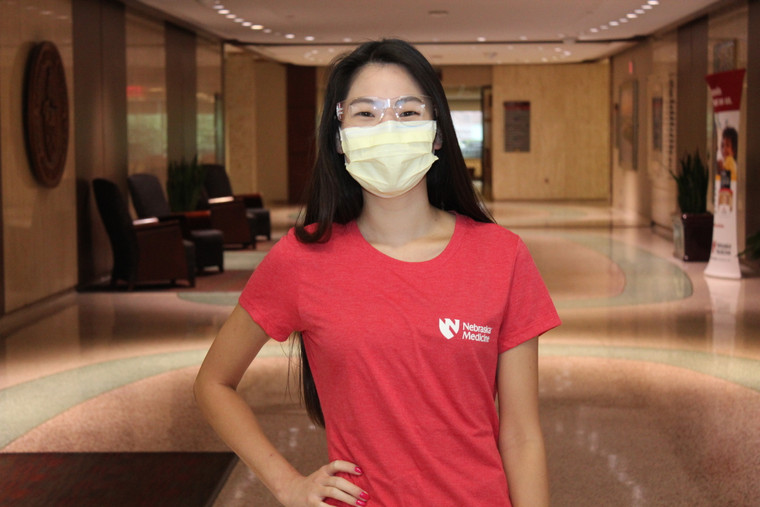 Sara Lewandowski, mammography technologist, models the heathered red ladies T-shirt. 