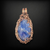 Copper wire wrapped pendant with a blue quartz cabochon