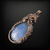 Copper wire wrapped pendant with a flower carved blue onyx cabochon