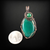 Copper wire wrapped pendant with a green onyx cabochon