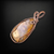 Handmade copper wire wrapped pendant featuring a tan color agate cabochon.