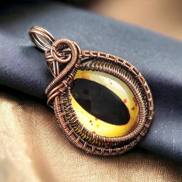 Copper Wire-Wrapped Pendant with Yellow Eye