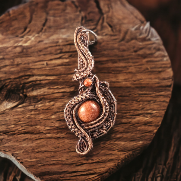 Handmade Twisted Flame Copper Wire Wrapped Red Goldstone Pendant