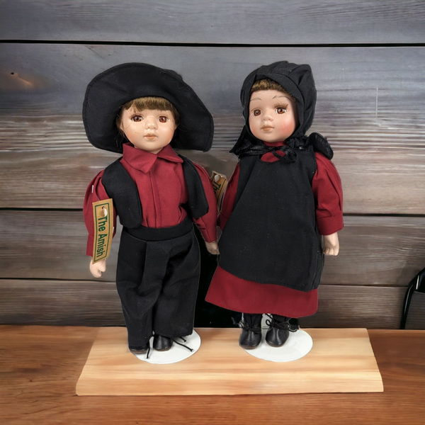 The Amish Porcelain Boy and Girl Dolls with Stands