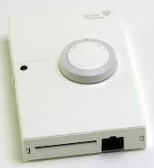 Johnson Controls NS-BTP7002-0, industrial thermostat with a white circular control dial and a black connection port.