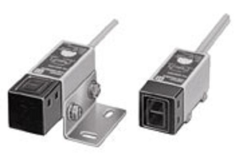 Omron E3S-2DB41 2M, photo of industrial photoelectric sensor with rectangular shape and metallic body, featuring black sensing face and silver mounting bracket.