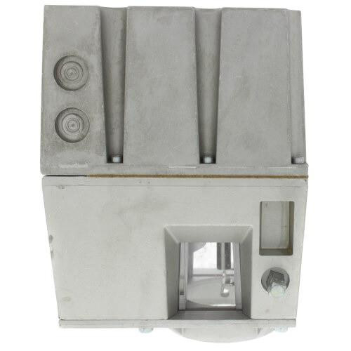 Honeywell product, industrial sensor or controller device with a metallic gray upper section featuring two circular components and a lower section with a square opening and adjustment screw.