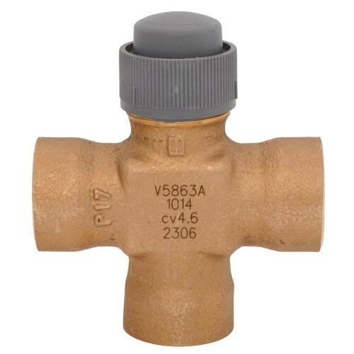 Honeywell, brass valve with gray cap and T-shaped design for plumbing or HVAC systems.