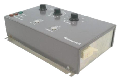 Honeywell, electronic control unit with knobs and switches for industrial or home safety systems.