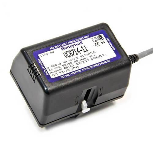Honeywell actuator, a compact black electronic device with a display screen and wiring for controlling HVAC systems.