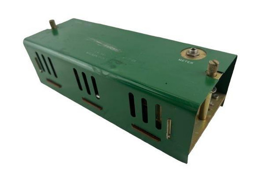 Honeywell product, industrial electronic component or module in green casing with vents and connection terminals.