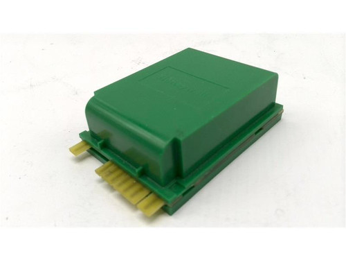 Honeywell electronic module, green rectangular electronic component with yellow pins at one end.