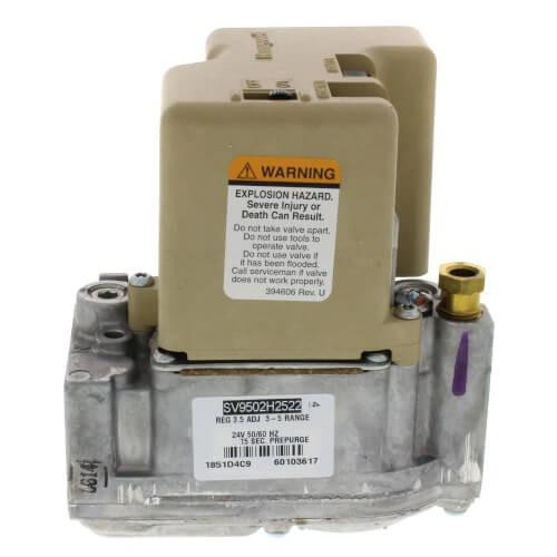 Honeywell product, industrial valve actuator with warning label and metallic base.