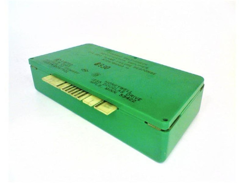Honeywell, industrial sensor module in green casing with gold connectors for HVAC or automation systems.