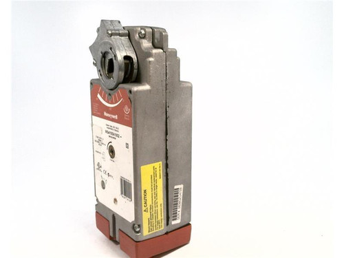 Honeywell industrial safety sensor, rectangular metallic device with a label and warning sticker on white background.