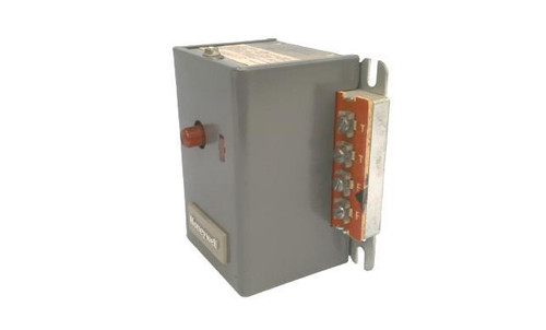 Honeywell industrial control device, gray electrical component with connection terminals and a small knob for connections.