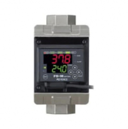 Keyence digital temperature controller, electronic device with LED display showing temperature readings in red and green, used for industrial temperature regulation.