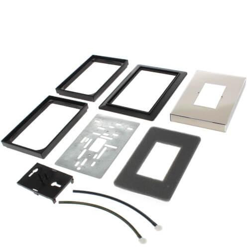 Honeywell product components, installation kit with frames, mounting box, and wiring accessories for smart home or security system.