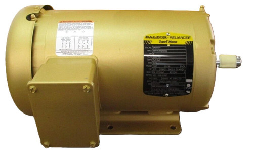Baldor Reliance Super E Motor, industrial electric motor in beige with a black label and metal shaft.