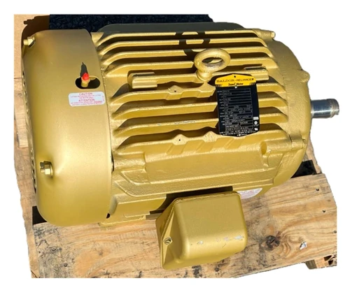 Baldor Electric Motor, industrial yellow electric motor with cooling fins and control label, mounted on wooden pallet for shipping or storage.