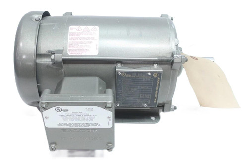 Baldor EM7014T, industrial electric motor with metallic silver finish and attached nameplate, for industrial applications.