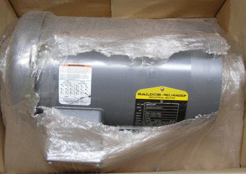 Baldor VM3556T, industrial motor in packaging with protective plastic wrap and labels showcasing specifications.