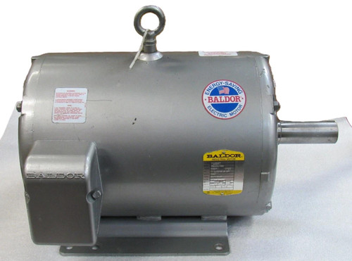 Baldor M1225T, industrial electric motor with silver cylindrical body, lifting eye at the top, and mounting base, designed for high-performance industrial applications.