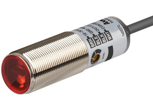 Autonics BRQM100-DDTA-C, industrial proximity sensor with cylindrical metallic body and red sensing face.
