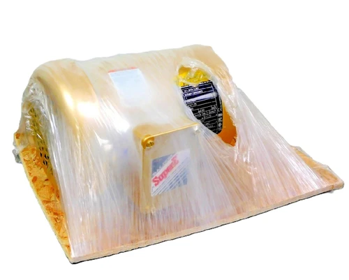 Baldor M1-M1A-L2B1, industrial motor in protective plastic wrapping, ready for installation or shipment.