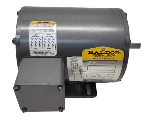 Baldor M3009, industrial electric motor with grey metallic body and attached grey junction box.