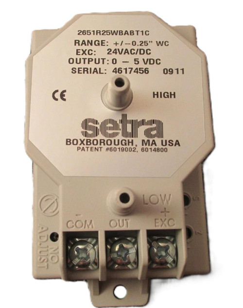 Aaon R37030, industrial control relay device with white plastic casing featuring terminals labeled COM, OUT, and EXC for electrical connections.