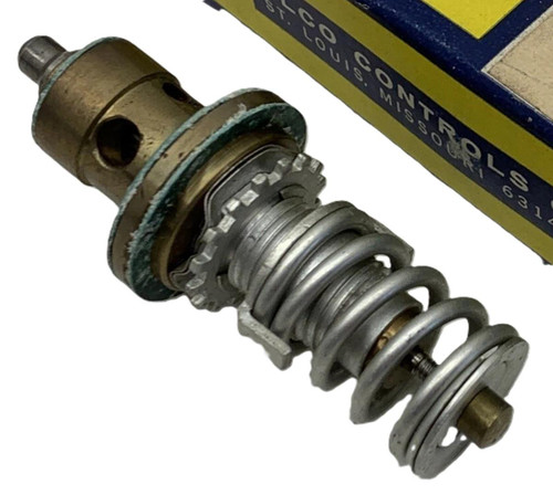 Alco Controls XC724-B4B, industrial mechanical part with a spring and gear, used for machinery or control systems.