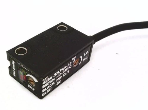 Allen-Bradley sensor, black rectangular sensor with wiring cable and white labels for industrial automation.