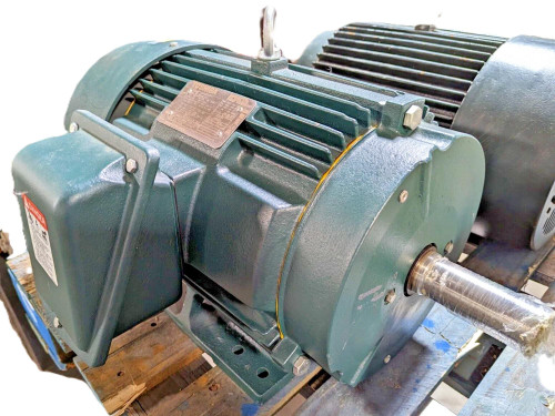 Toshiba Y756XSSB41A-P, industrial electric motor with green casing and large metal shaft, mounted on wooden pallet for industrial use.