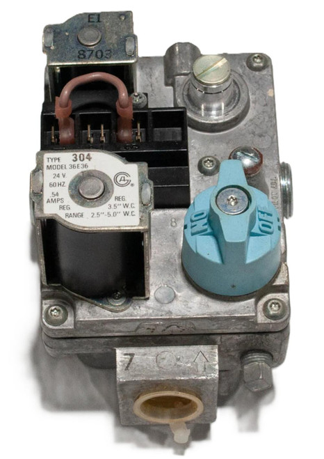White-Rodgers product, industrial mechanical component with a blue rotary dial, electrical wiring, and metallic parts.
