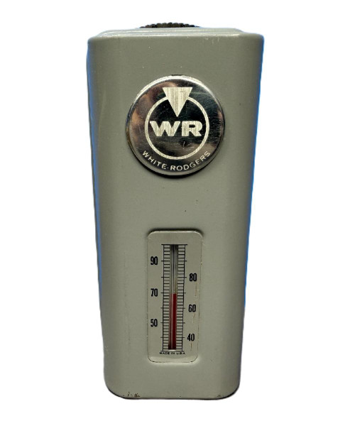 White-Rodgers, thermistor temperature sensor device with a metallic logo and a temperature gauge showing about 70 degrees Fahrenheit.